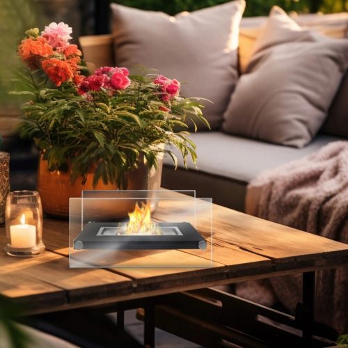 Szabadon álló asztali füstmentes biokandalló otthoni kertbe, fekete díszítő kövekkel